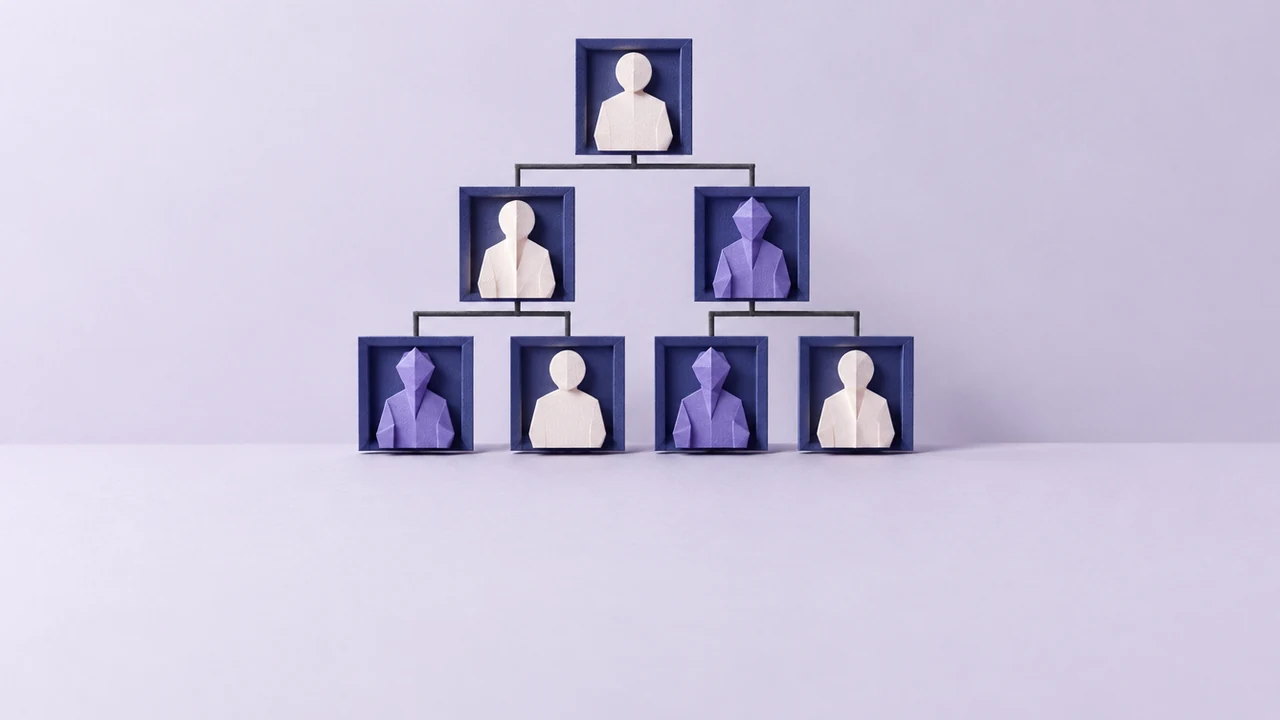 A standing paper org chart of linked frames, some holding faceless white figures and others faceted violet figures